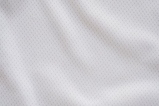 White fabric sport clothing football jersey with air mesh texture background