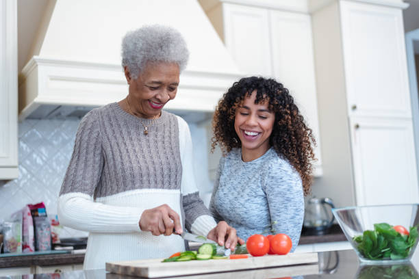 istock Mother and daughter cooking together 1141094485