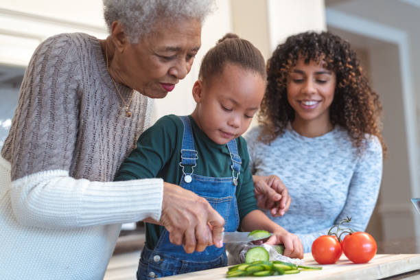 istock Family generations cooking together 1141094513