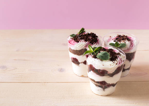 istock Homemade cake dessert. Trifle on pink background 1141094776
