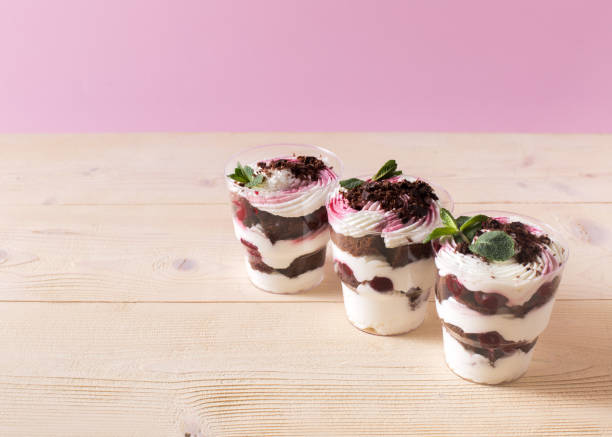 istock Homemade cake dessert. Trifle on pink background 1141094779