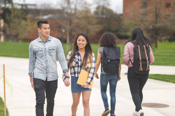 istock College students walking across campus to their classes 1141096042