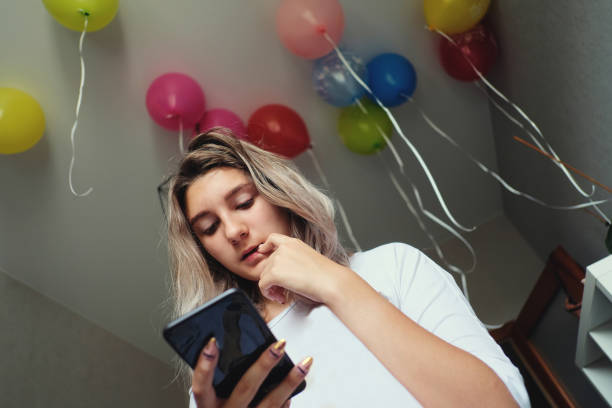 istock Millennial girl using her phone 1141096436