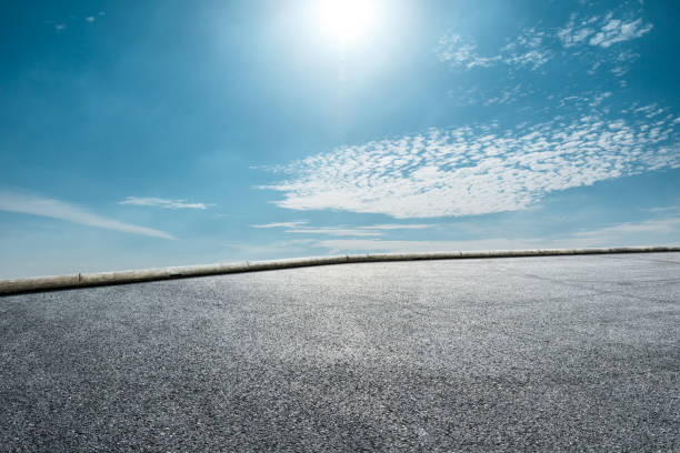 istock Asphalt race track ground and beautiful sky clouds 1141101164