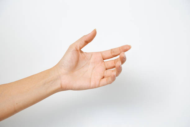 istock Close up hand holding something like a bottle or can isolated on white background 1141102615