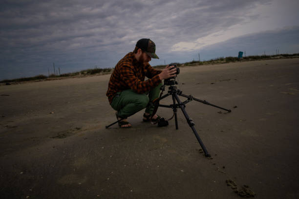 istock Beach Photographer In Action Before A Storm 1141104058