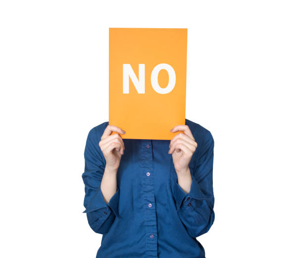 a woman holding a paper in front of her face with no word - opposition party imagens e fotografias de stock