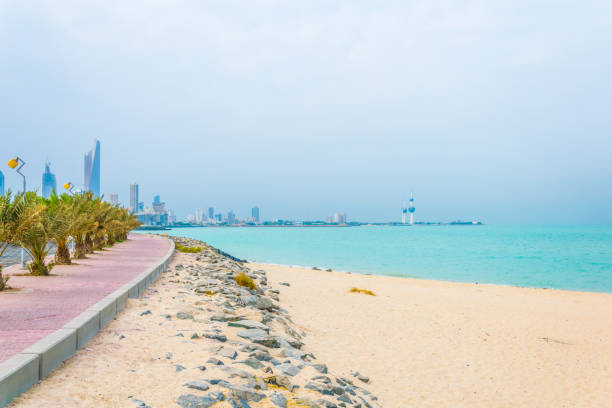 The architectural engineering art of Kuwait City towers, an aerial photo of skyscrapers and facilities on the coast of the Arabian Gulf Street, urban development and progress in a modern and advanced style, famous tourist attractions