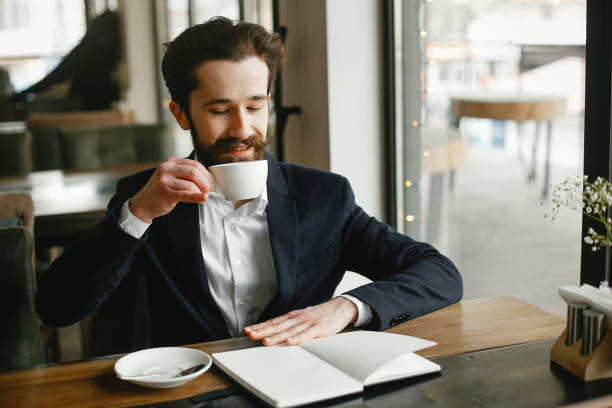 istock Stylish businessman working in a office 1141112341