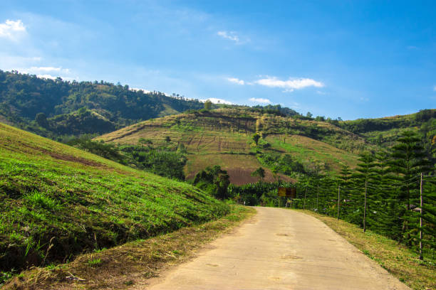 istock Driving a car on mountain curve road. 1141115255