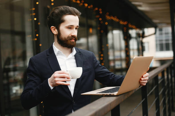 istock Stylish businessman working in a office 1141115353
