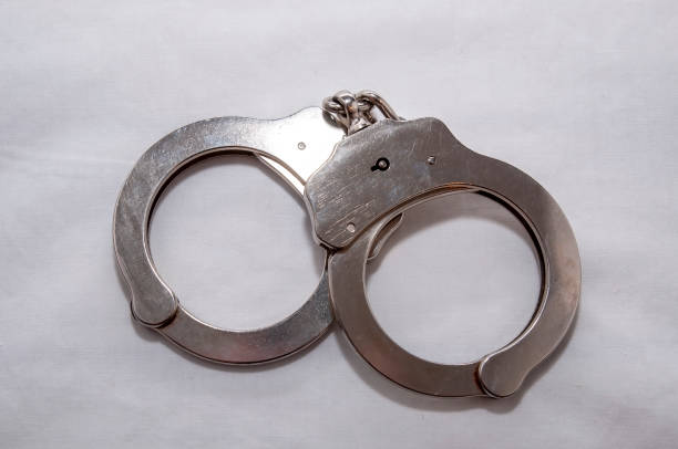 istock A single set of silver, metal handcuffs 1141119069