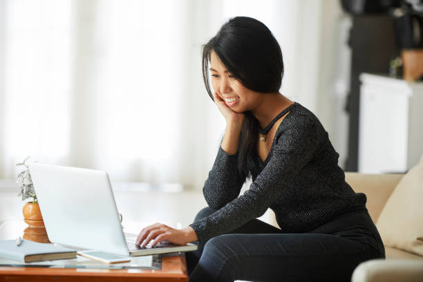 istock Young woman working on laptop 1141123058