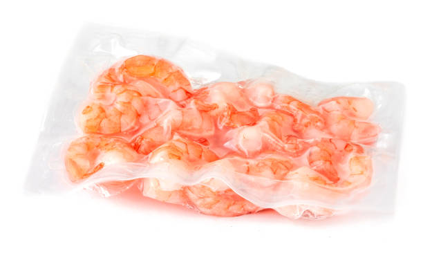 Frozen  shrimps in a vacuum package  isolated on white background