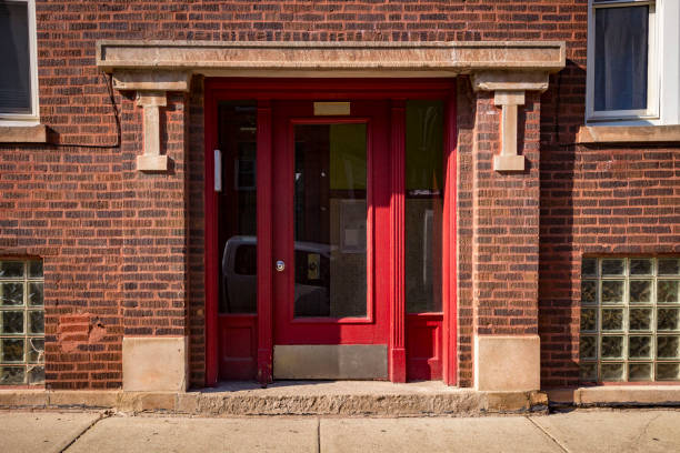 istock Building entrance with a red door 1141124912
