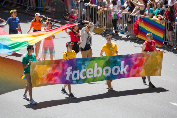 facebook corporation en el gay pride parade de seattle - homosexual gay pride business rainbow fotografías e imágenes de stock