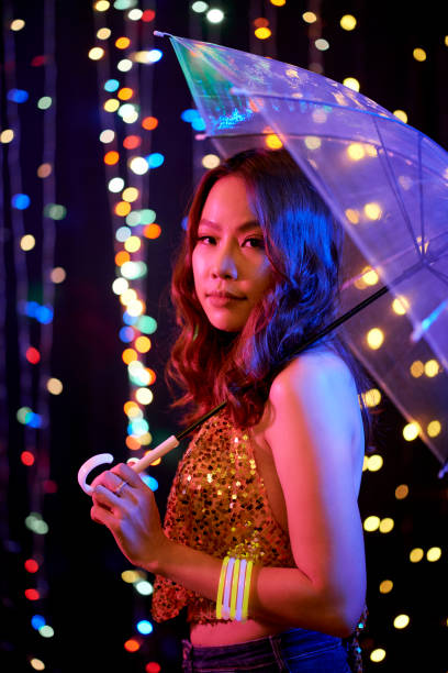 istock Asian fashion model with umbrella 1141129996
