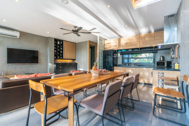 This modern asian style kitchen has many windows, with bamboo cabinets and floors.