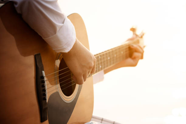 istock Close up hand playing guitar 1141135205