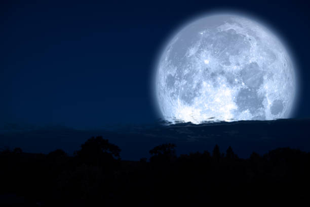 istock super milk moon back on silhouette mountain on night sky 1141135266