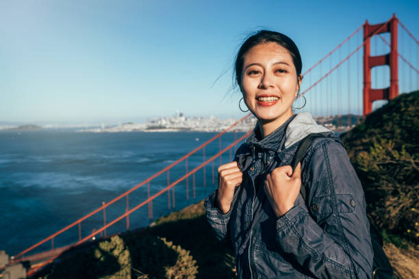 istock girl backpacker standing on mountain hills 1141137153