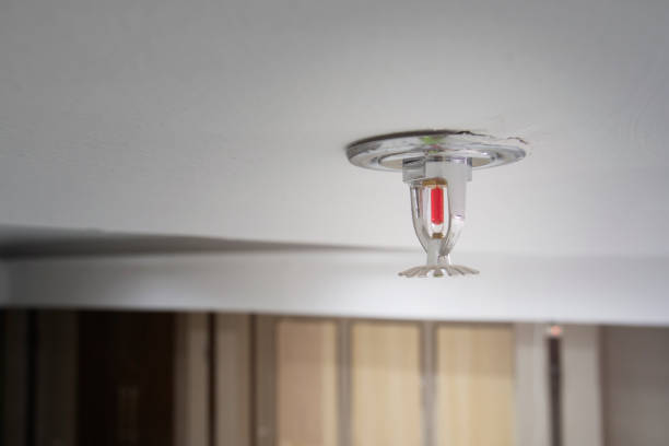 istock Fire extinguisher ceiling water sprinkler on the wall 1141139268