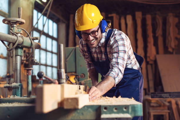 istock Carpenter cutting wooden plank 1141140983