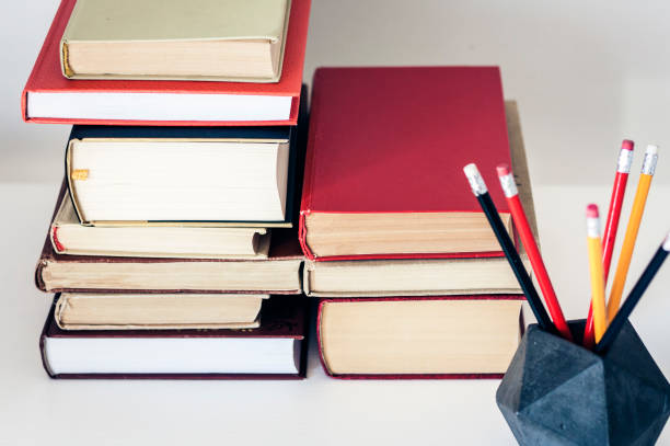 istock Stack of old books and pencils in office background for education concept 1141142108