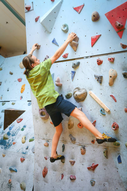 istock Teenage Boy Training Climbing On Indoor Climbing Wall 1141142385