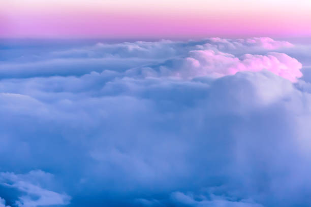 istock Beautiful sunset sky above clouds with nice dramatic light. View from airplane window 1141144865