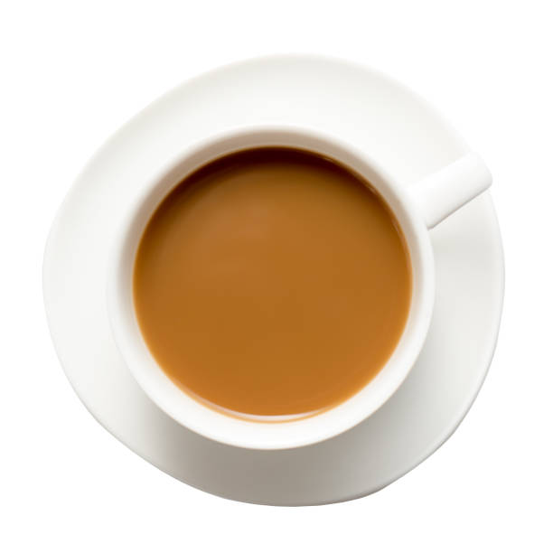 istock White Cappuccino cup of coffee on a plate isolated on white background. Top view. 1141146098