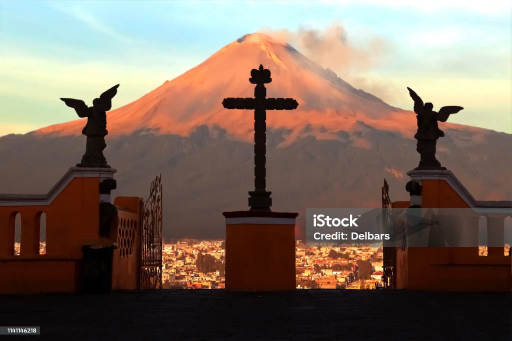 View of the active volcano Popokatepetl from the Catholic Church of St. Mary. Mexico. Cholula city. Popocatepetl Volcano Stock Photo