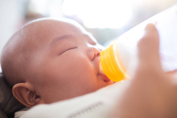 istock Feeding newborn baby 1141148203