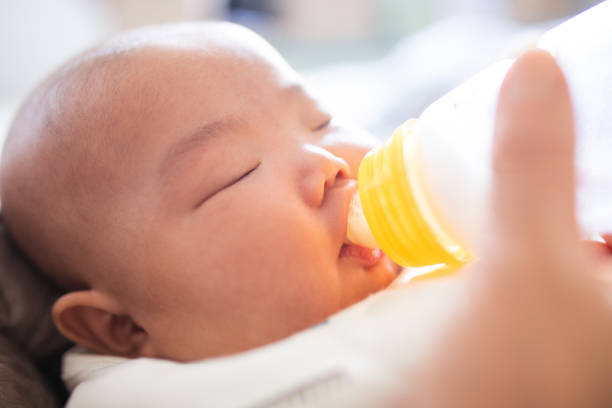 istock Feeding newborn baby 1141148206