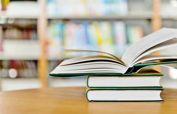 istock Stack of books on the table of public library 1141148823
