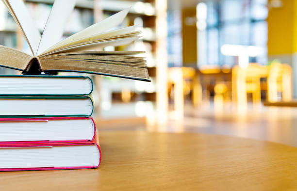 istock Stack of books on the table of public library 1141149407