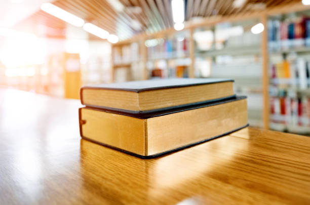 Two books on the table of public library.