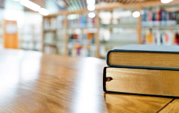 istock Two books on the table of public library 1141149653