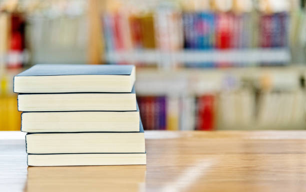 istock Stack of  books on the table of public library 1141149705