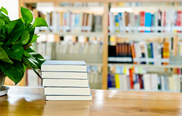 istock Stack of  books on the table of public library 1141149711