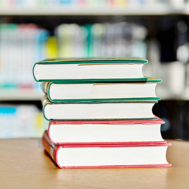 istock Stack of  books on the table of public library 1141149719