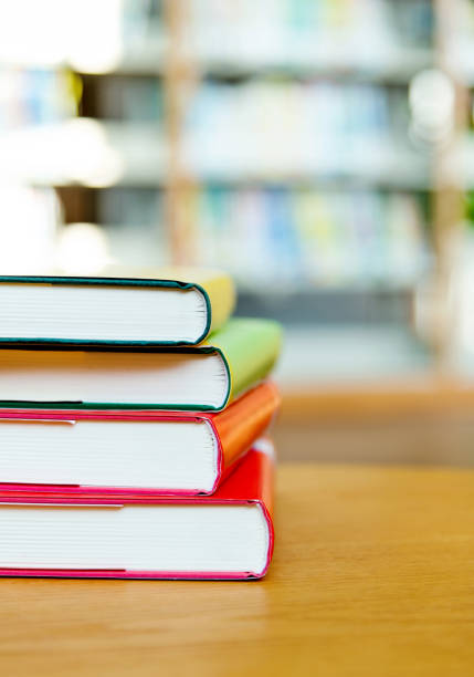 istock Stack of  books on the table of public library 1141149745