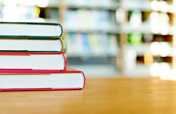 istock Stack of  books on the table of public library 1141149754