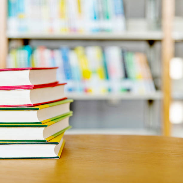 istock Stack of  books on the table of public library 1141149772