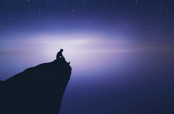 istock Man on top of a mountain peak 1141149956