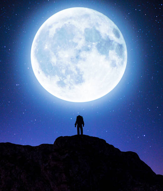 istock Astronaut on top of a mountain peak 1141149999