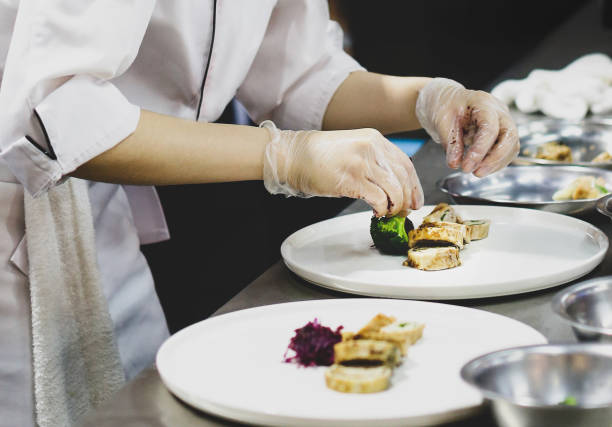 istock Chef preparing food, meal, in the kitchen, chef cooking, Chef decorating dish 1141151989