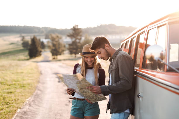 istock A young couple on a roadtrip through countryside, looking at a map. 1141152029