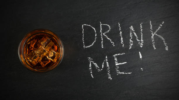 istock Iced Whiskey Glass on Natural Black Stone Background 1141154290