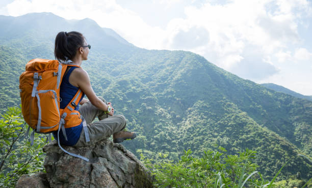 istock young woman backpacker  enjoy the view at mountain peak 1141157714